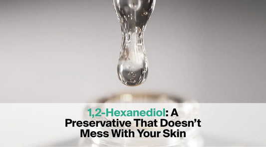  A clear, viscous liquid is shown dripping from a glass dropper into a container, with the text overlay "1,2-Hexanediol: A Preservative That Doesn't Mess With Your Skin".