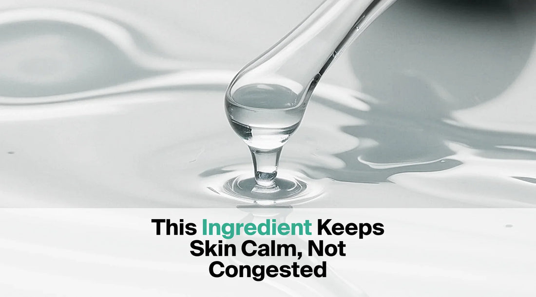  A glass dropper releases a drop of clear liquid onto a surface of white liquid, with the text overlay "This Ingredient Keeps Skin Calm, Not Congested".