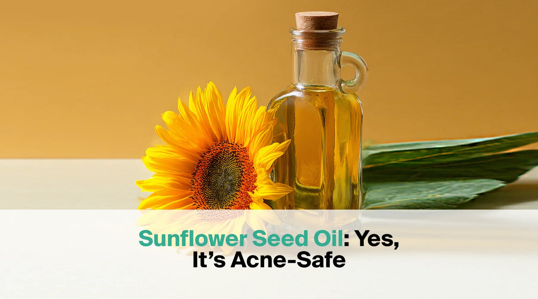  A glass bottle with a cork stopper containing yellow sunflower seed oil is placed next to a vibrant yellow sunflower on a two-toned background, with the text overlay "Sunflower Seed Oil: Yes, It's Acne-Safe".